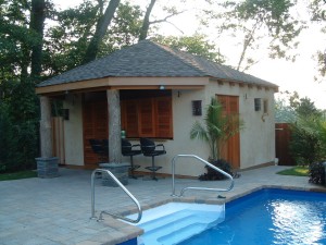 Exterior shutters and doors on a pool-side cabana