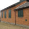 custom sized exterior shutters on a one room schoolhouse