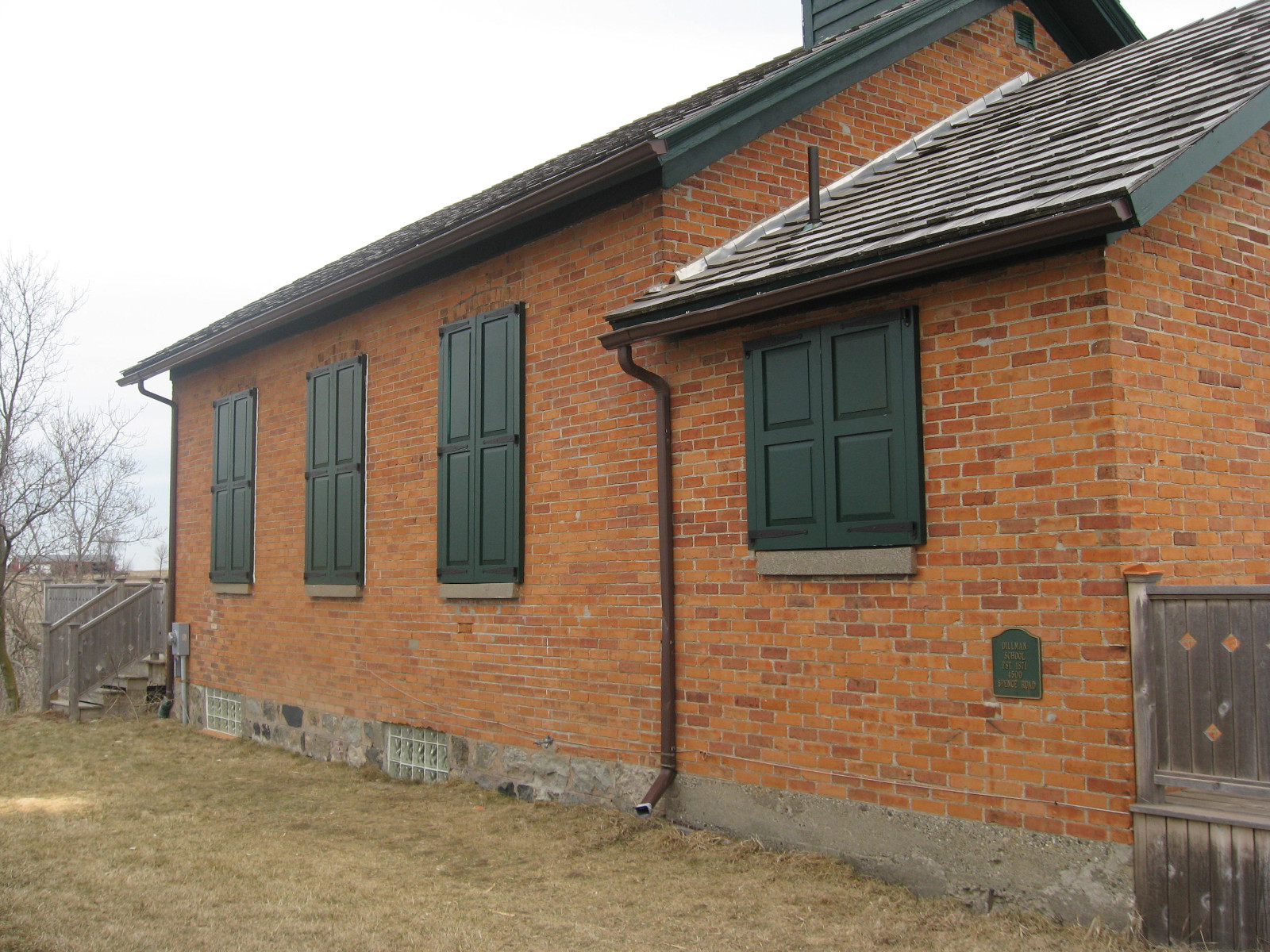 custom sized exterior shutters on a one room schoolhouse