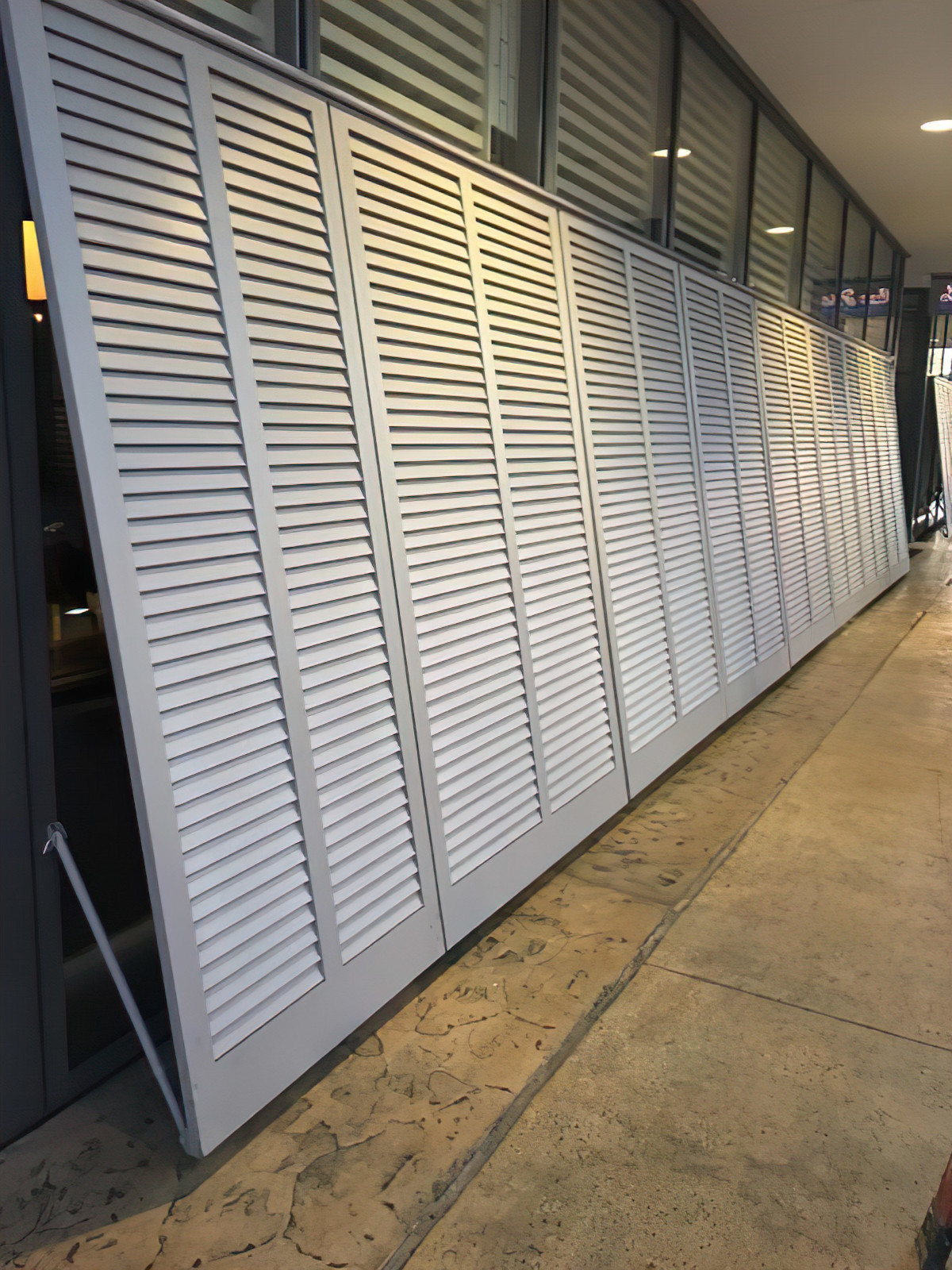 fixed louver plantation shutters for privacy at a restaurant
