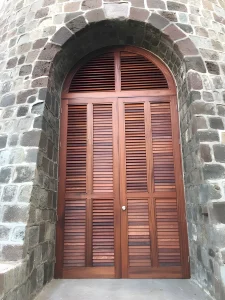 Arched operable louvered exterior shutters and doors